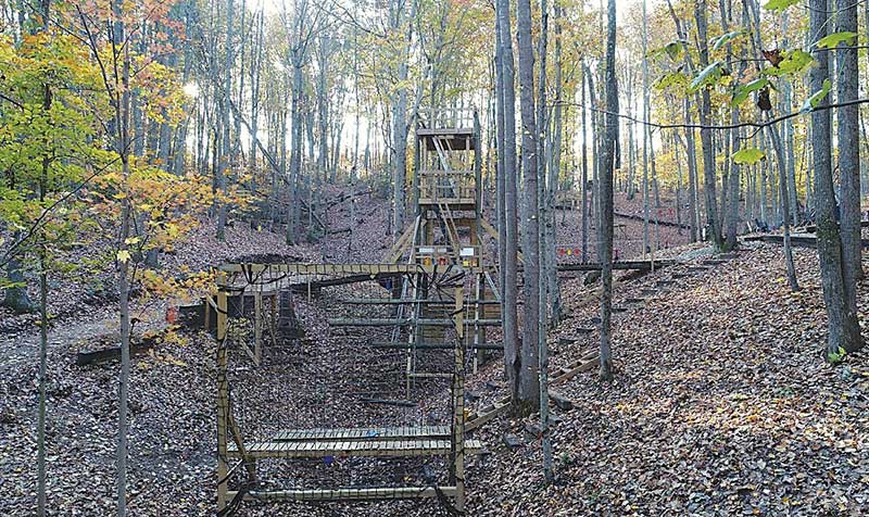 Overview from start point of live-fire obstacle course. Center of fire and movement complex is 40-foot tower. Advance is all uphill. Course is peppered with obstacles plus manmade and natural cover.