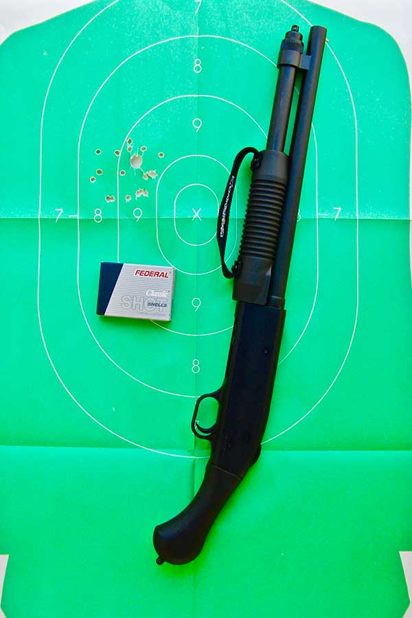 Firing Mossberg Shockwave 20-gauge from the hip takes some practice to determine where to hold, but it patterns well with Federal Classic #3 Buckshot at ten yards.