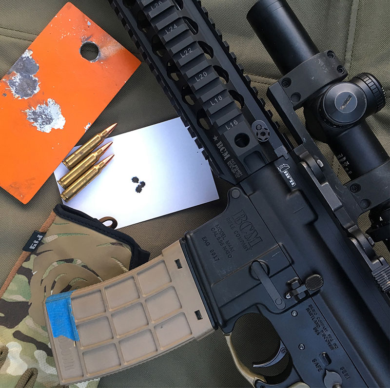 Steel plate and index card shot from standing barricade with BCM QRF upper and Black Hills Match ammo. Keeping shots on 3x5-inch target at 100 yards standing is no great feat with proper technique. One-hole group was a great and welcome surprise, but as they say in fine print on weight-loss commercials, “Results not typical.”