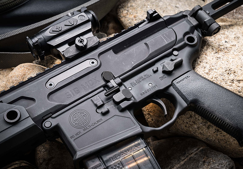 MCX Rattler features PDW upper paired with MCX VIRTUS lower. All controls on MCX Rattler are fully ambidextrous. It has SIG Matchlite Duo trigger. Gun here has Magpul K2 grip. SIG has subsequently come out with its own grip for MCX Rattler.