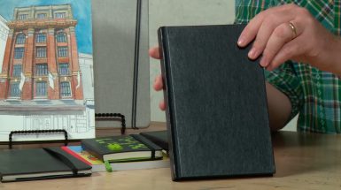 sketchbooks on a desk