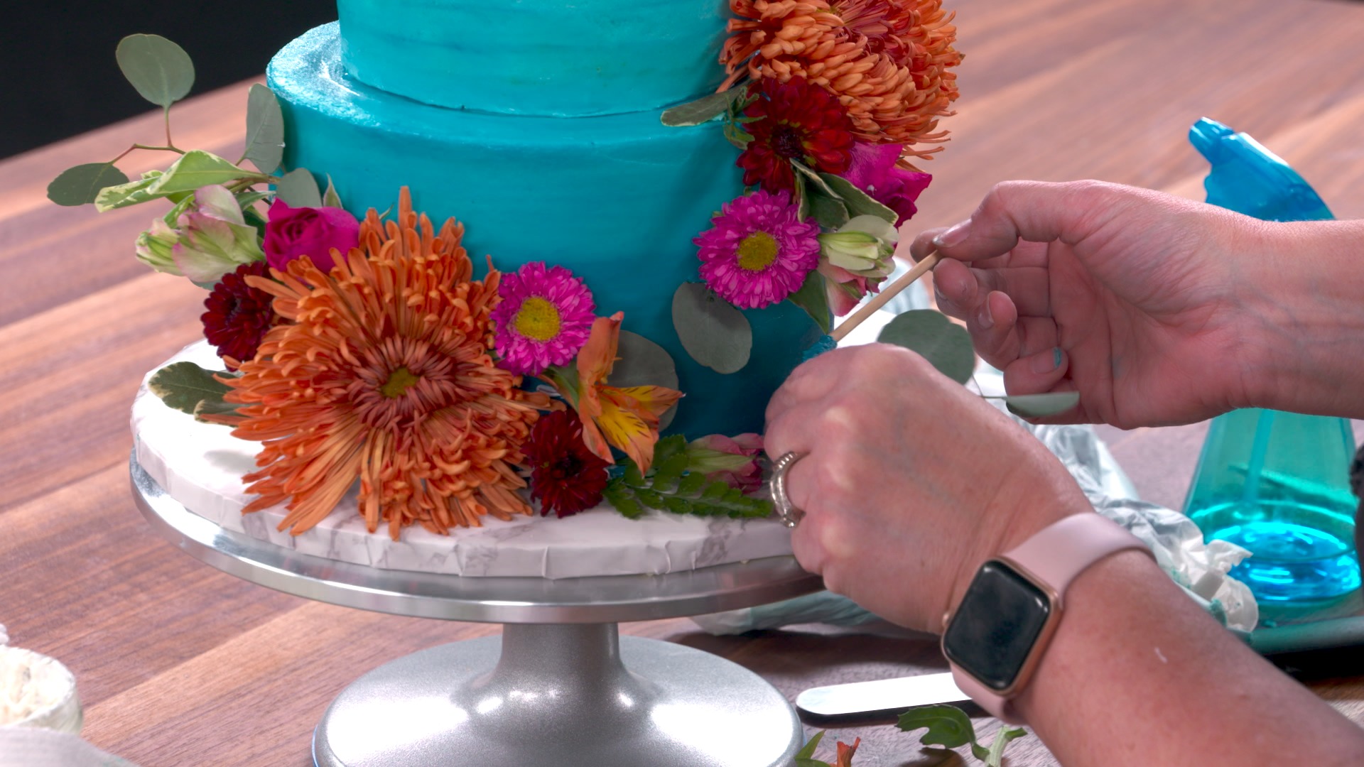 Adding Fresh Flowers to the Cake 