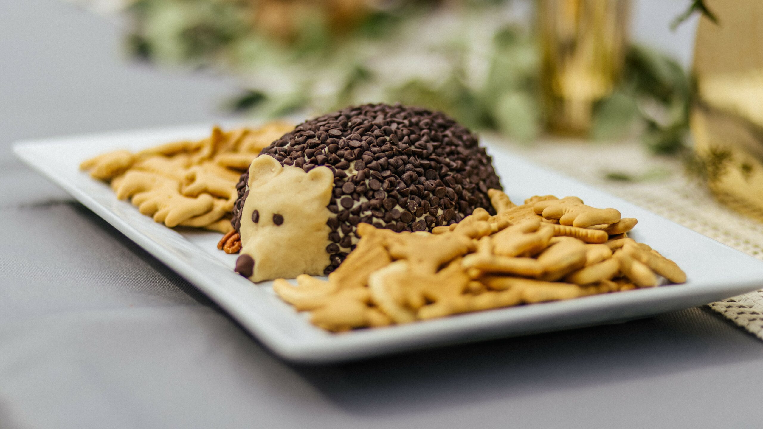 Shapeable Cookie Dough in the shape of a hedgehog on a platter with crackers