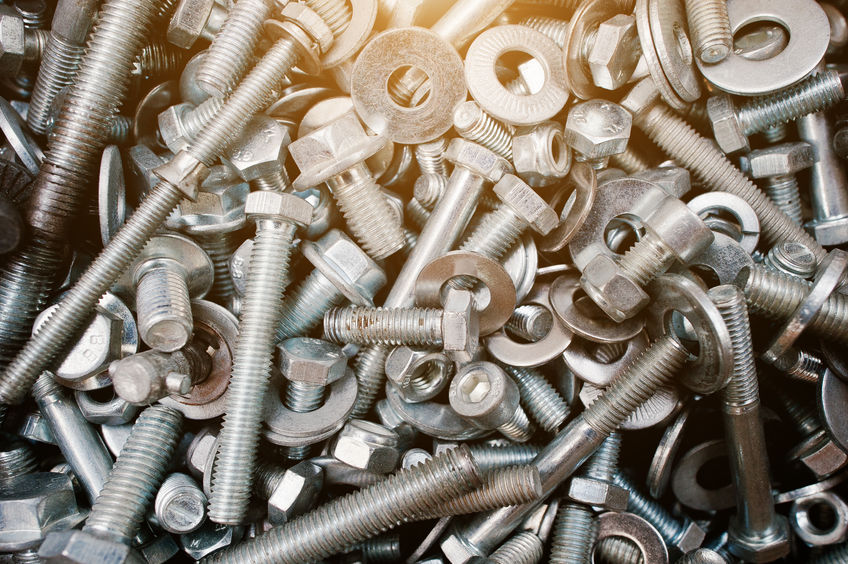 55463317 - background texture of nuts and bolts closeup
