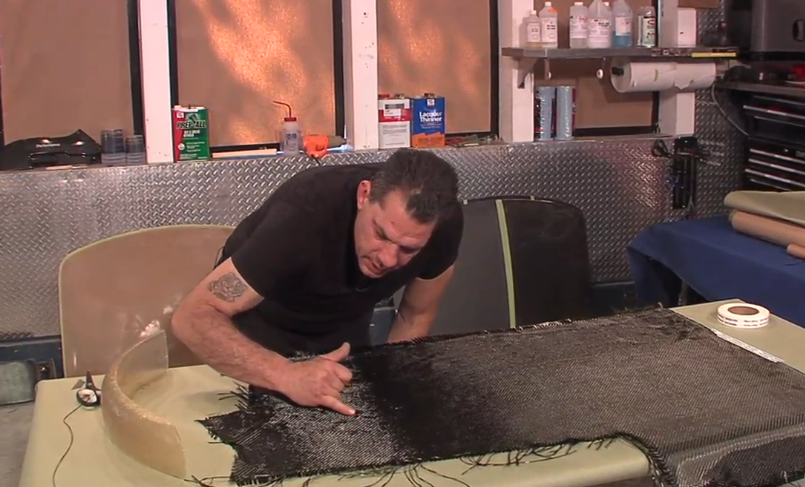 Man making a large carbon fiber part