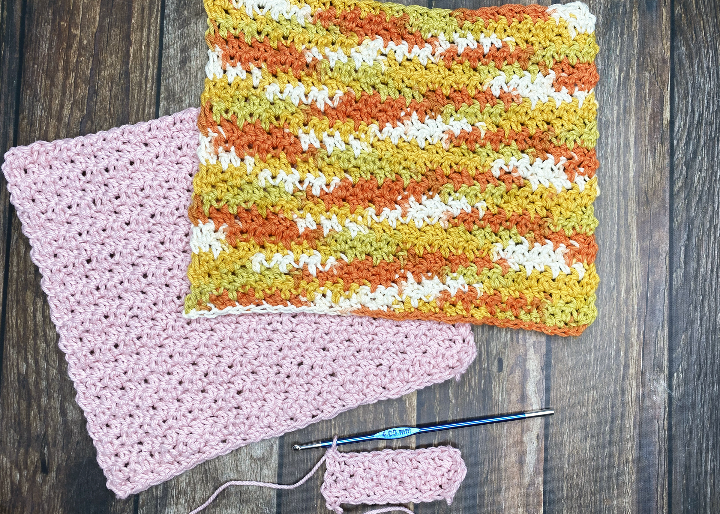 image of a tri-color crochet square and a pink crochet square with a crochet hook