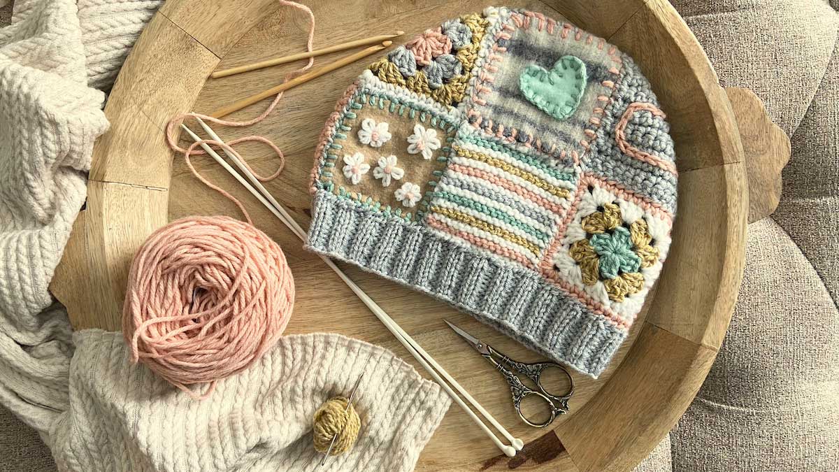 crochet beanie with patchwork squares with yarn and crochet hooks