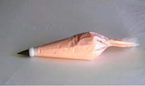 Icing Bag Filled with Pink Icing