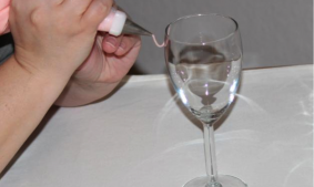 Hands Piping on a Wine Glass