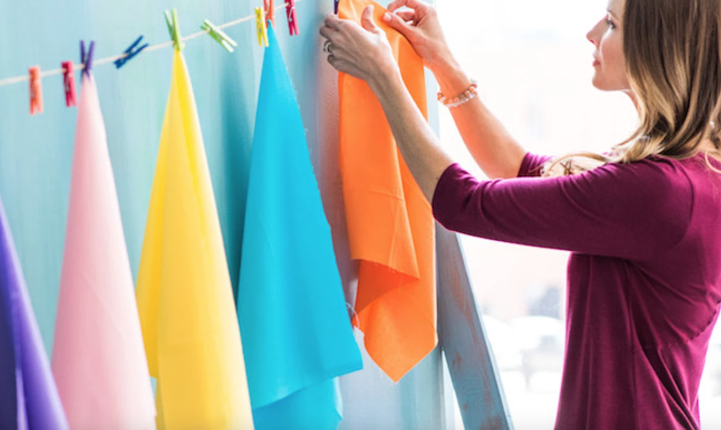 woman drying fabric