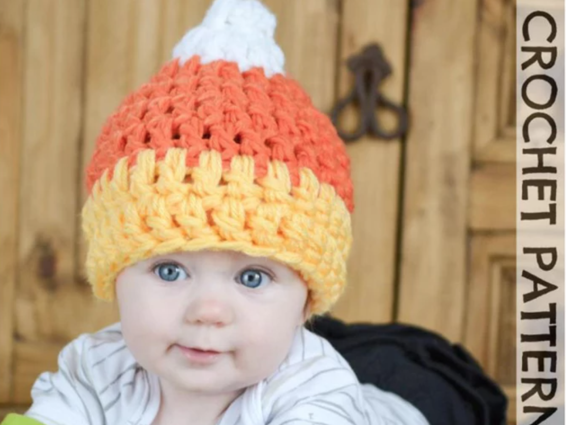 baby wearing crochet candy corn hat