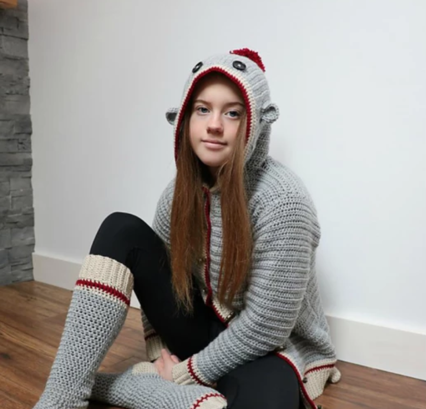 woman wearing crochet sock monkey costume