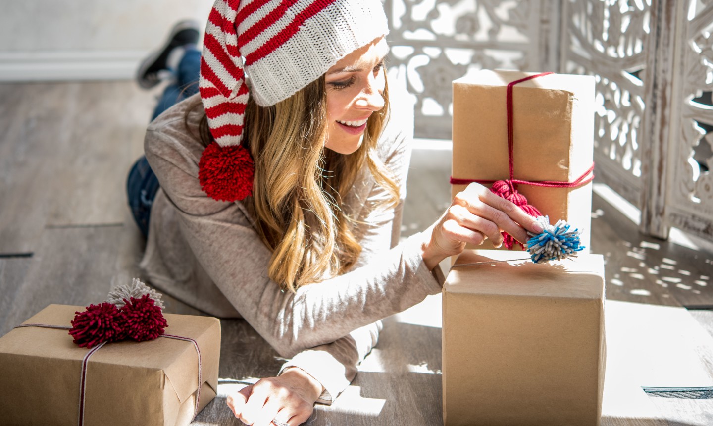 woman wrapping gifts