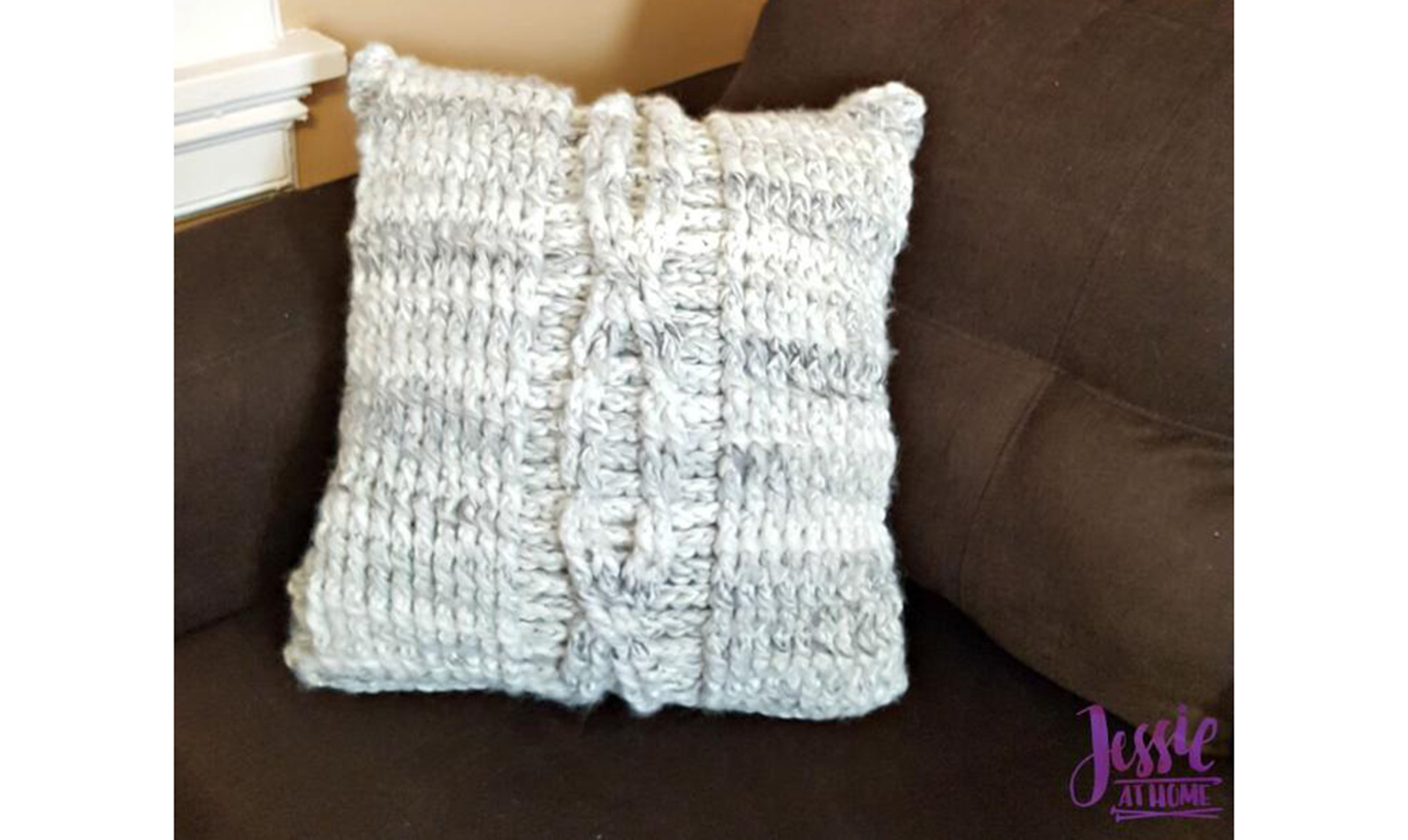 White and grey crocheted pillow