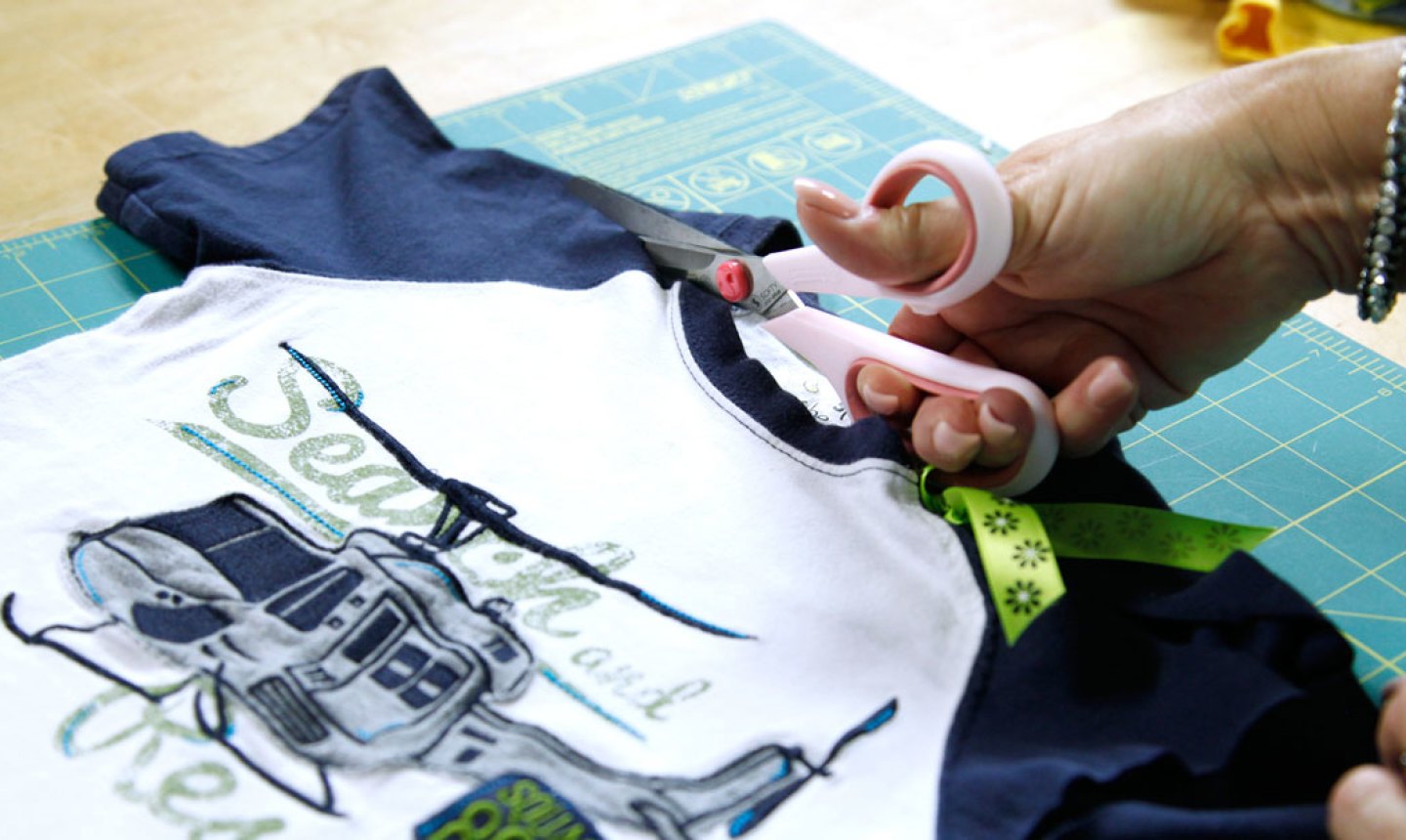 cutting a t shirt with scissors