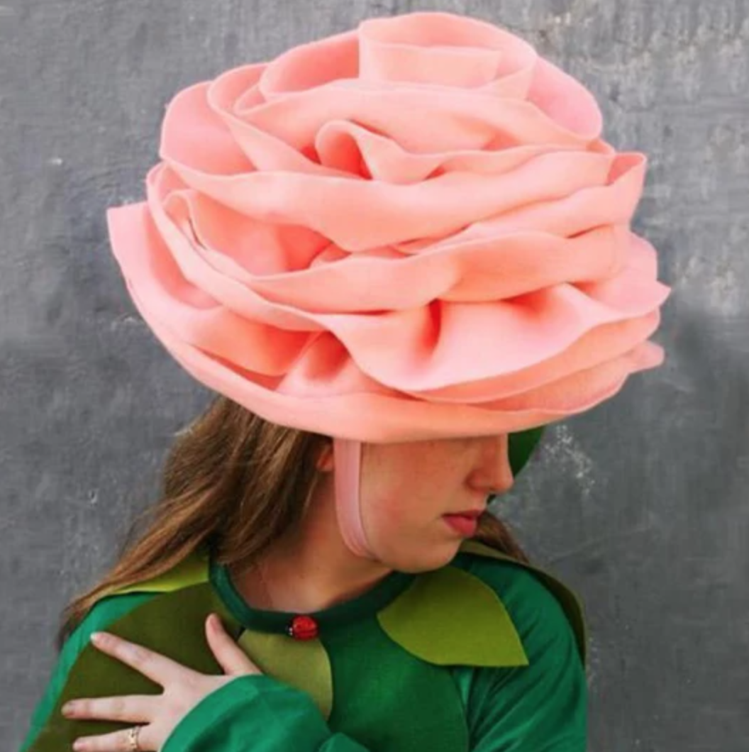 woman wearing rose hat