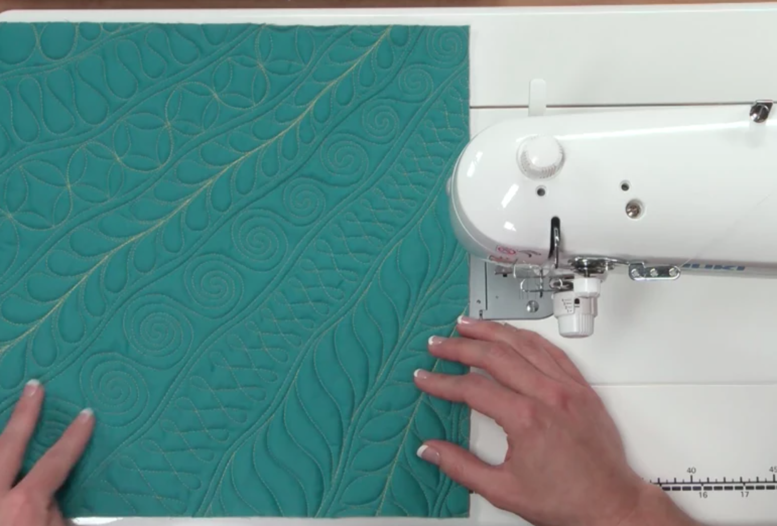 free-motion quilting teal fabric