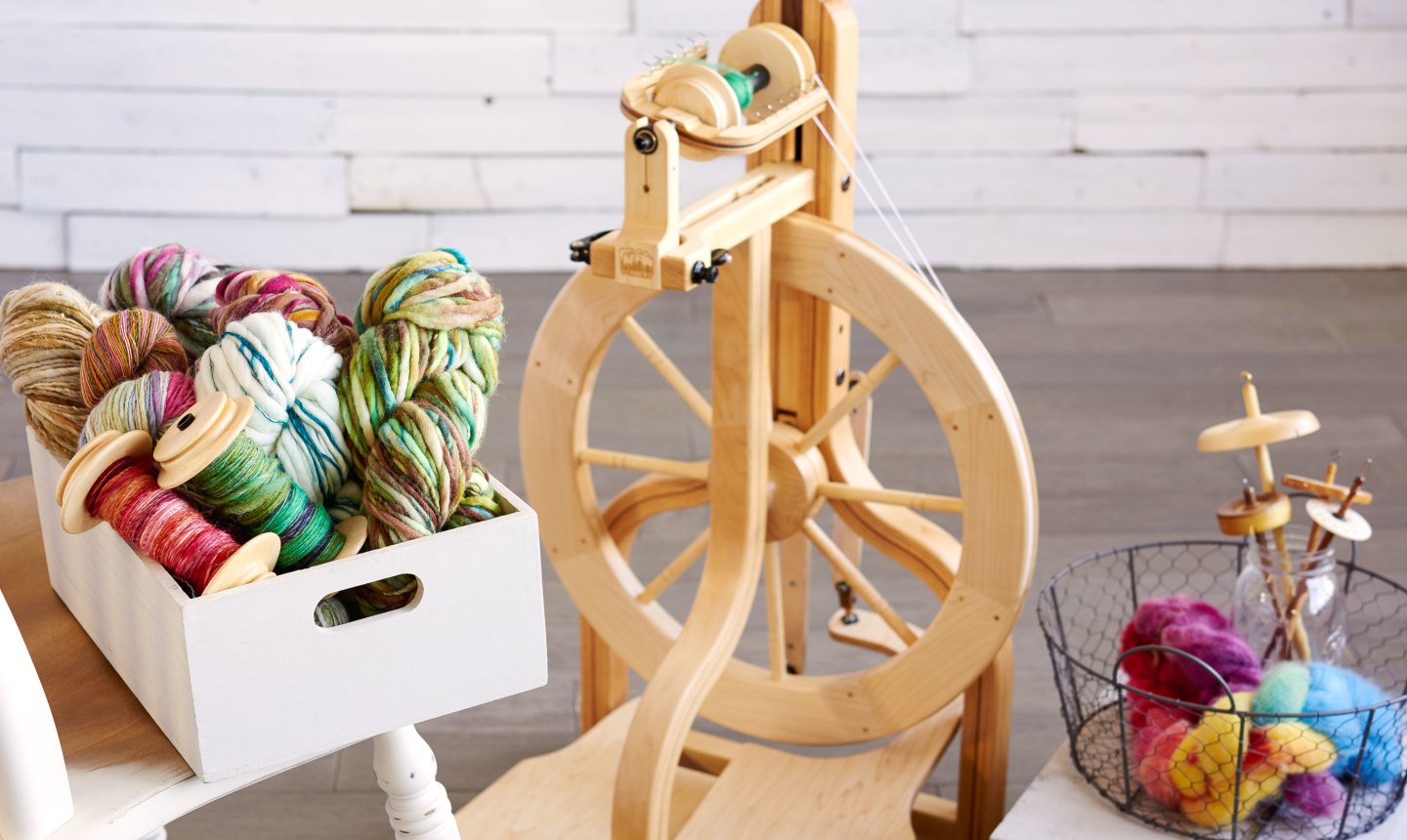 small spinning wheel with yarn