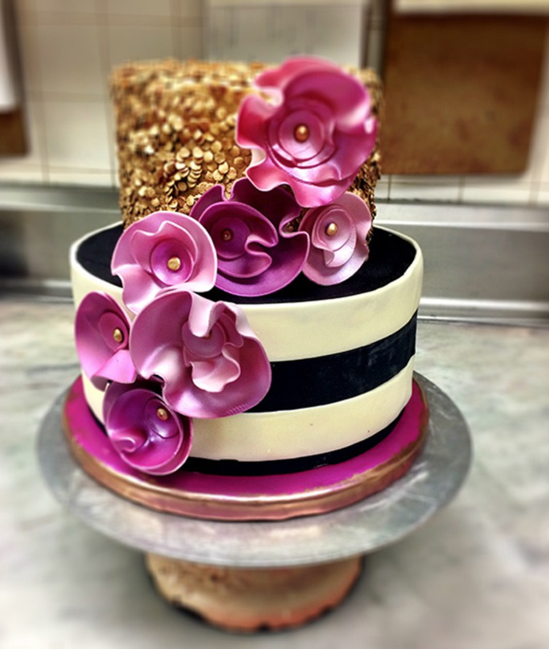 striped cakes with pink sugar flowers