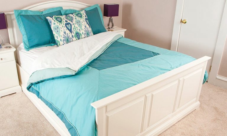 bed with teal bedding