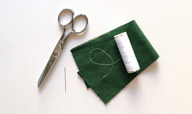 Scissors and thread with fabric
