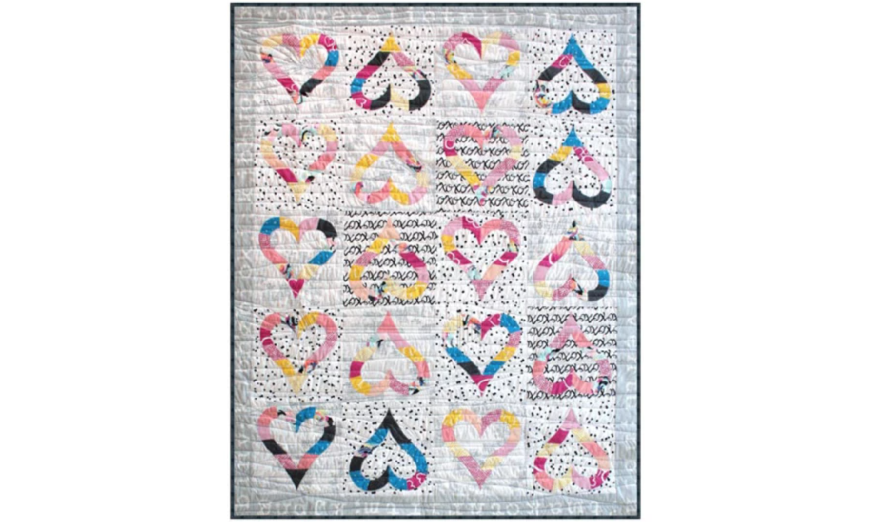 gray quilt with heart outlines