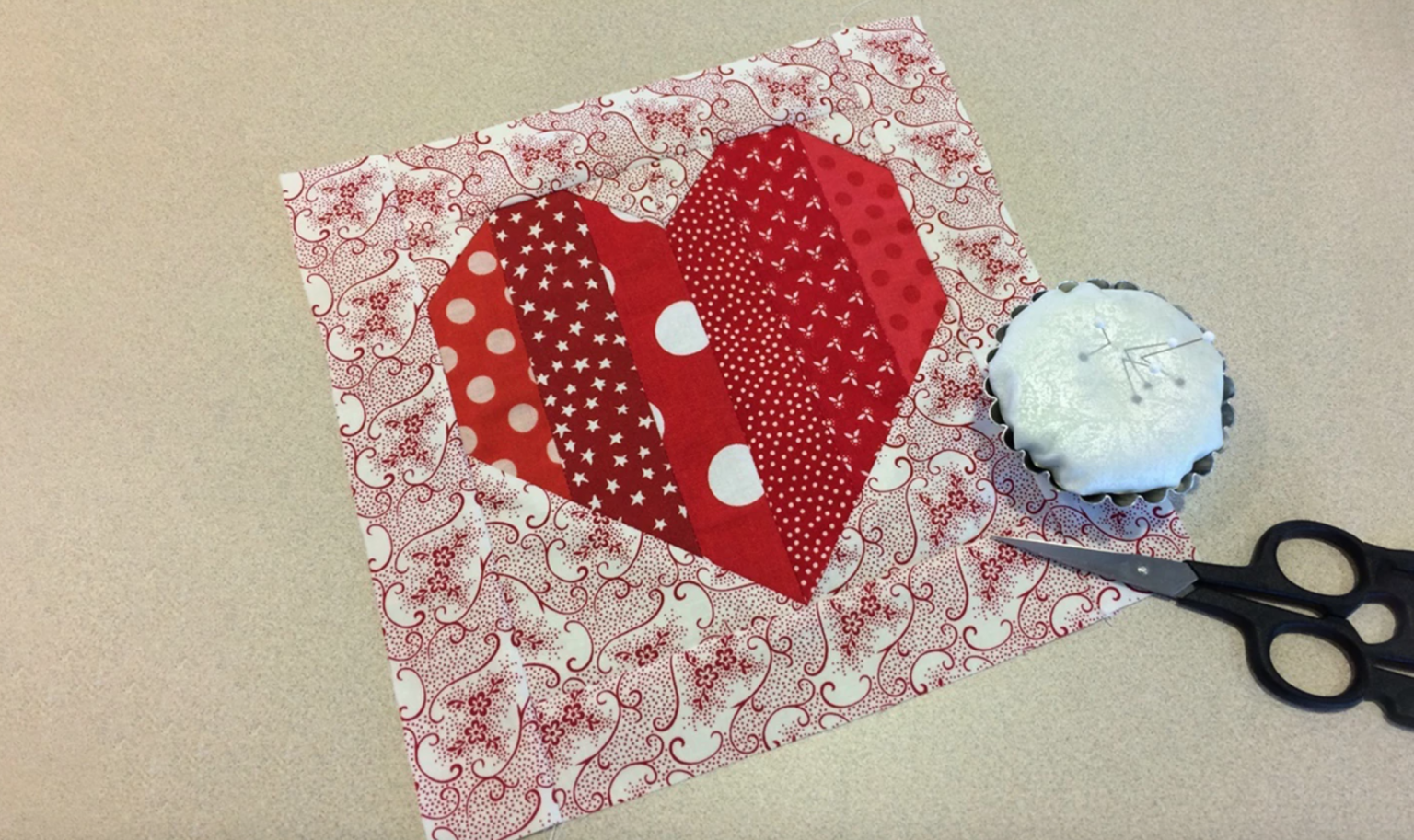 "Cute Heart-Shaped Block" is a Free Valentine's Day Quilt Block Pattern designed by Diane Knott from Craftsy!