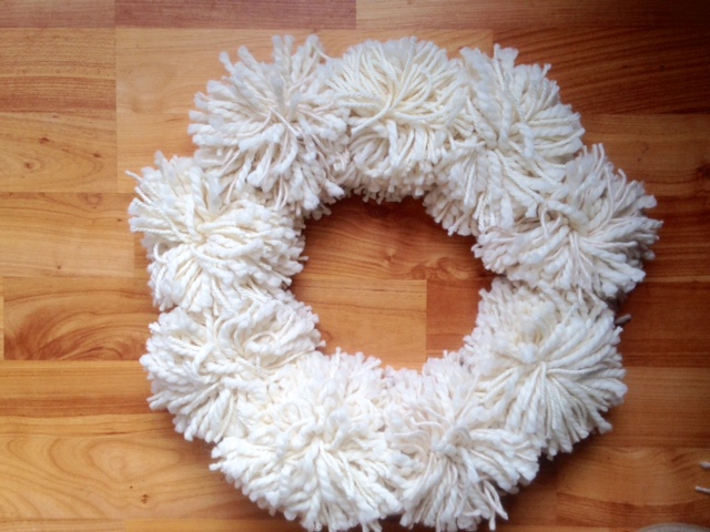 Make a Winter White Yarn Wreath With Leftover Scrapsproduct featured image thumbnail.