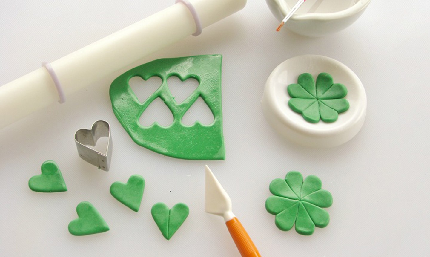 cutting out fondant clover