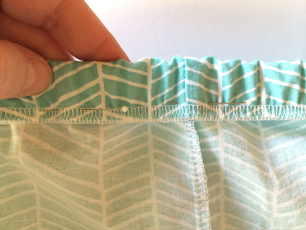 Pinned fabric over elastic
