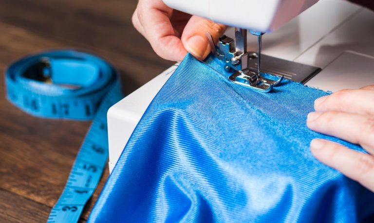 sewing blue fabric