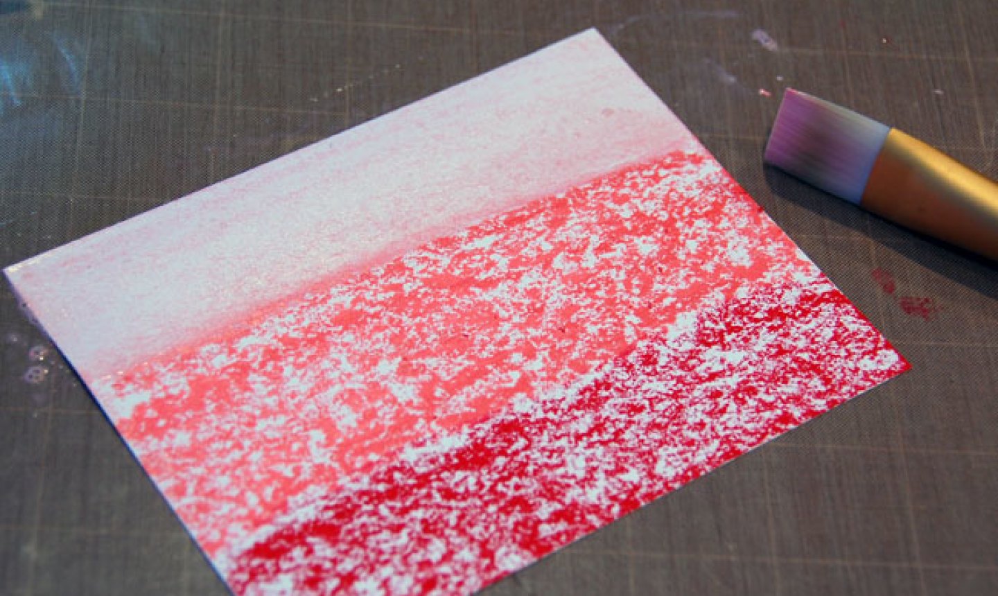 brushing gelatos on a card