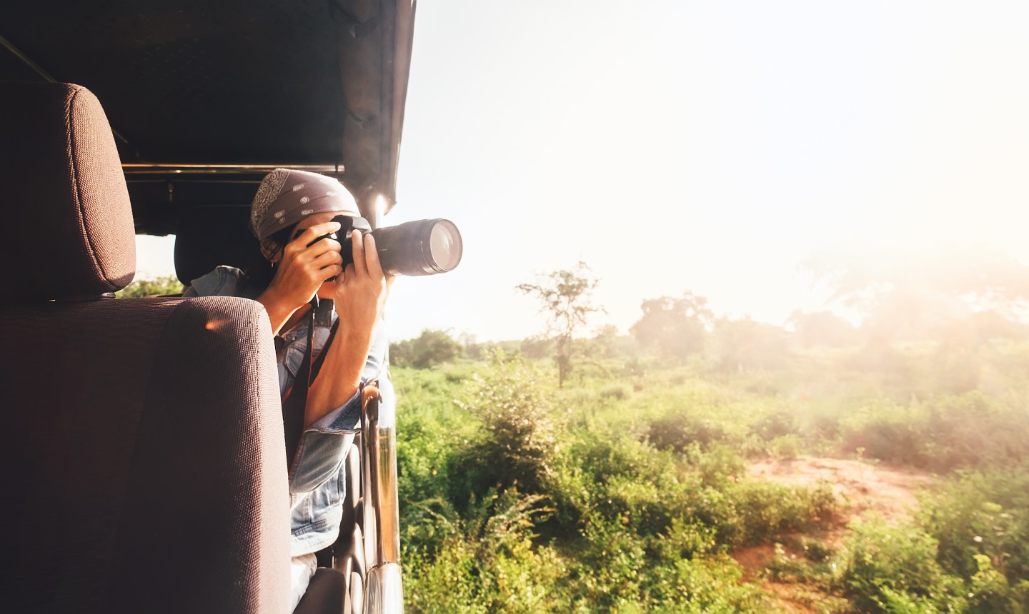 woman taking photo from vehicle