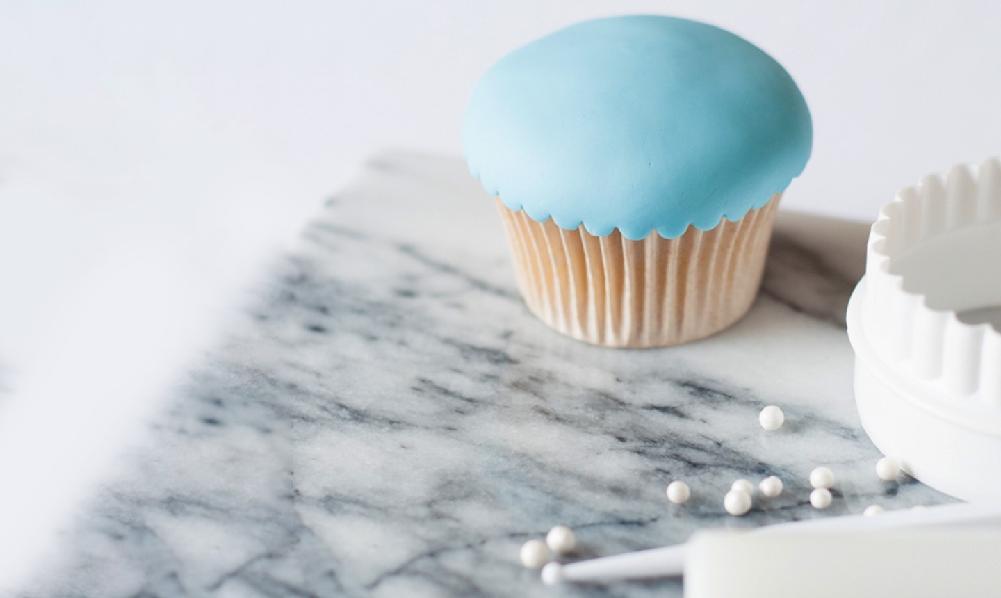 scalloped blue fondant cupcake