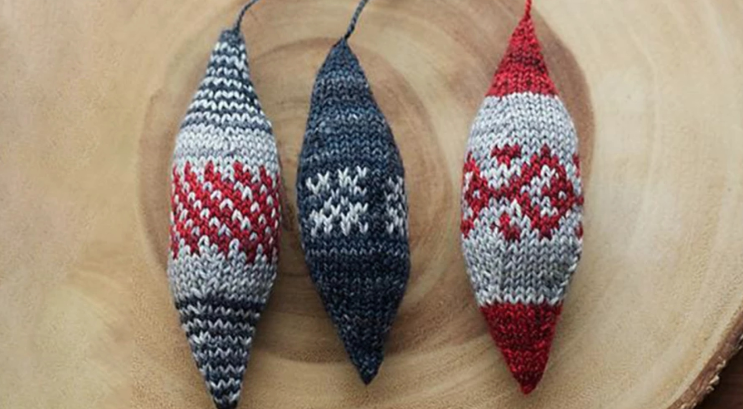 three knit fair isle ornaments