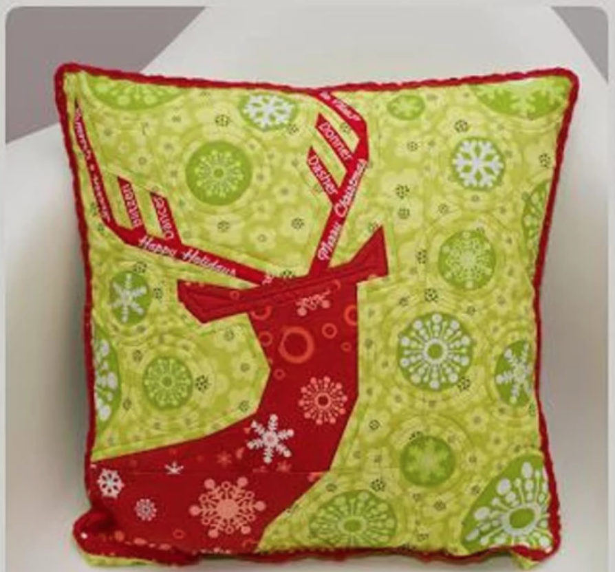 green and red quilted deer pillow