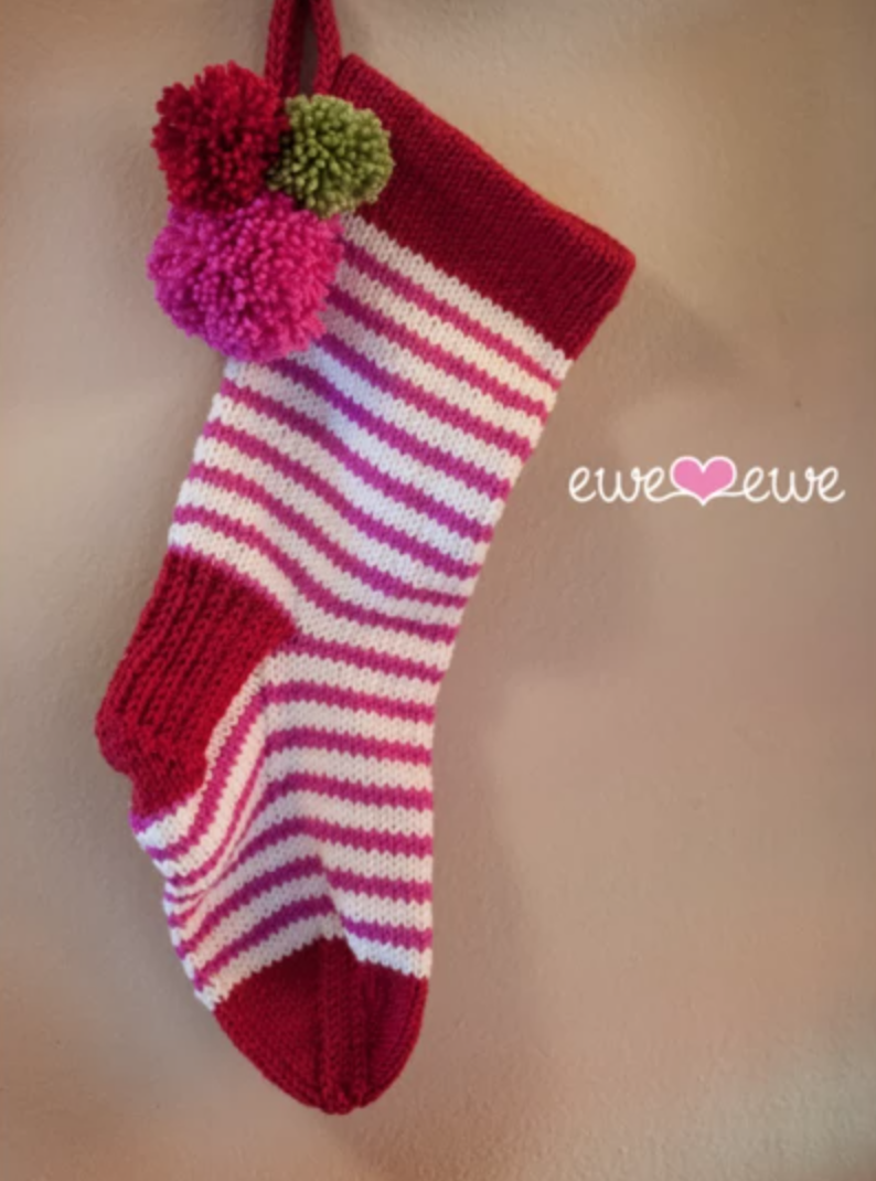 striped stocking with pom poms