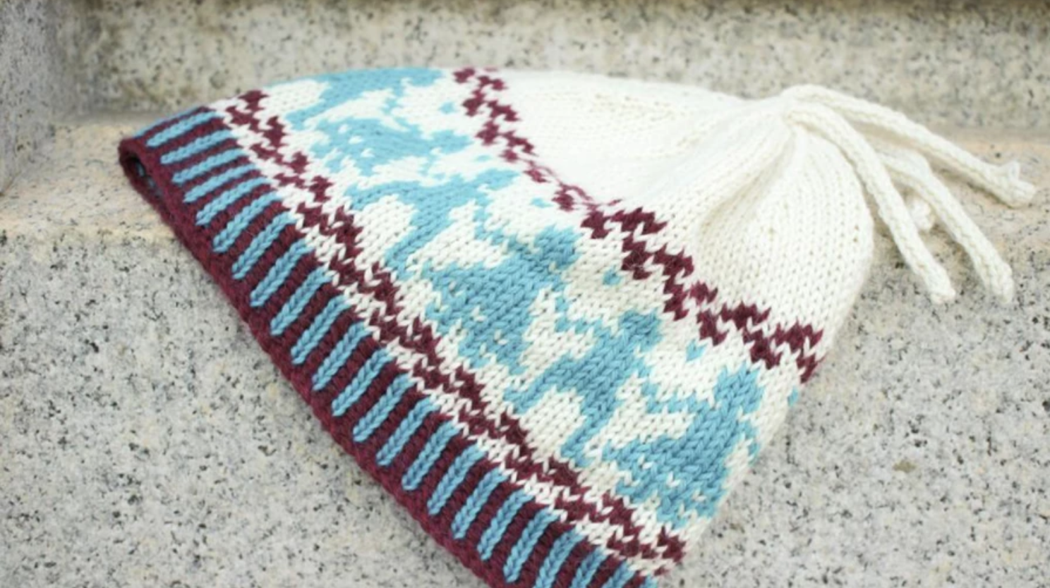 fair isle hat with boy and girl motifs