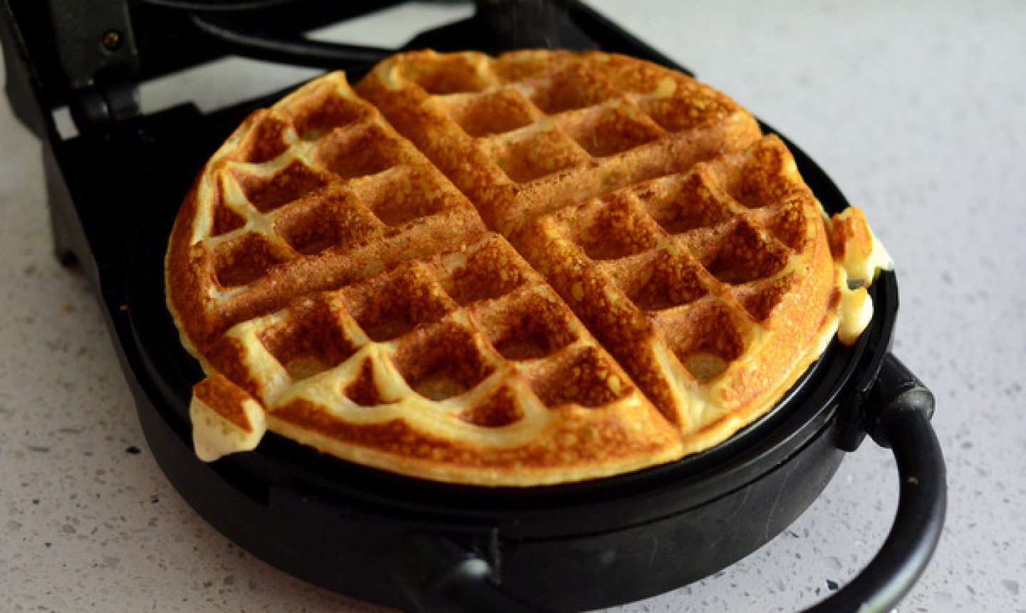 fresh waffle in iron