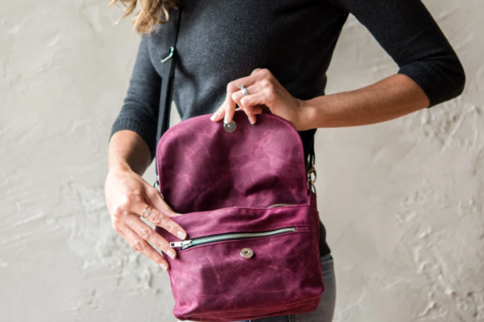 woman wearing cross body wax bag