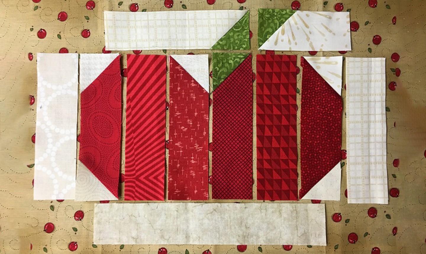 sewn strips of apple mug rug