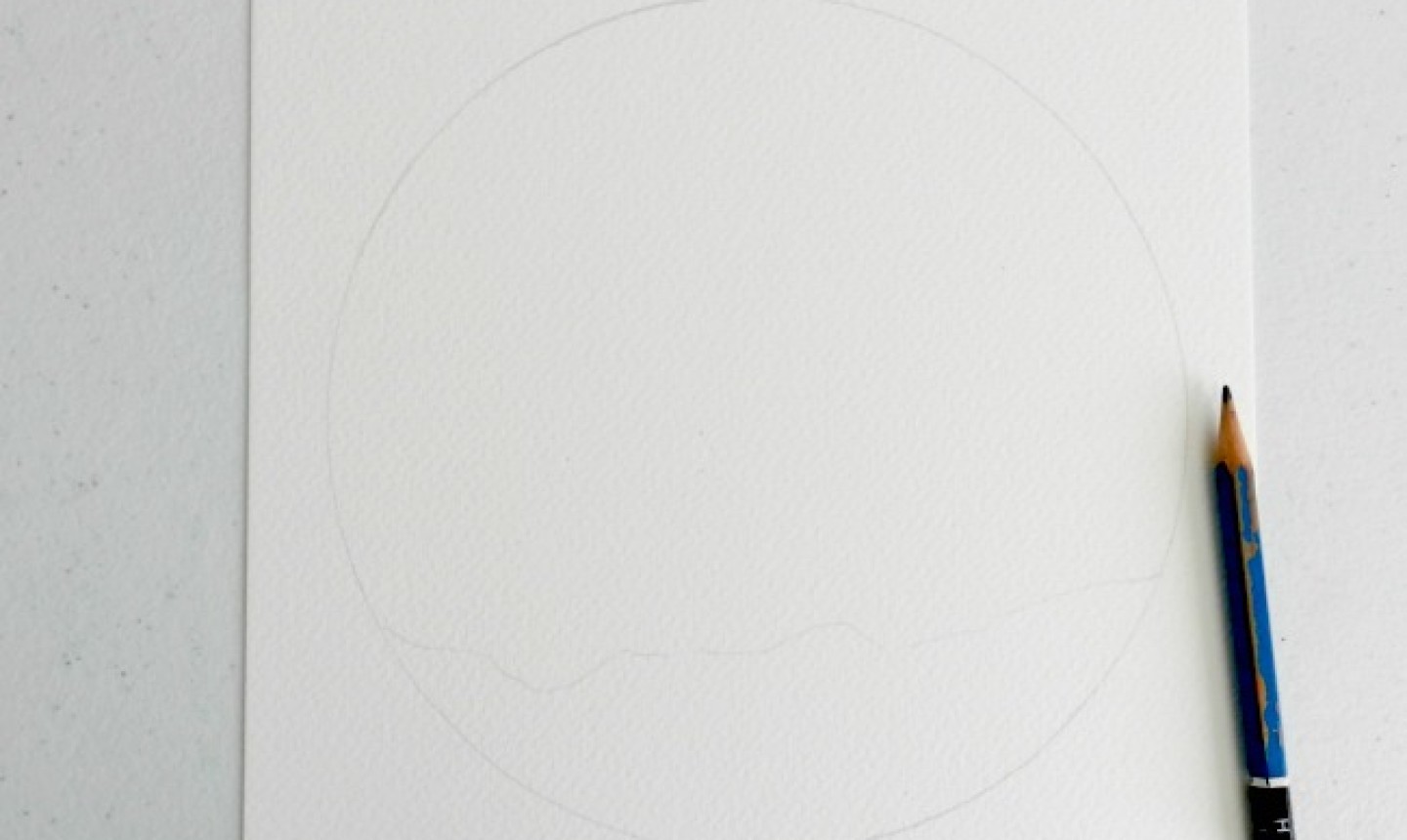 circle on watercolor paper drawn in pencil