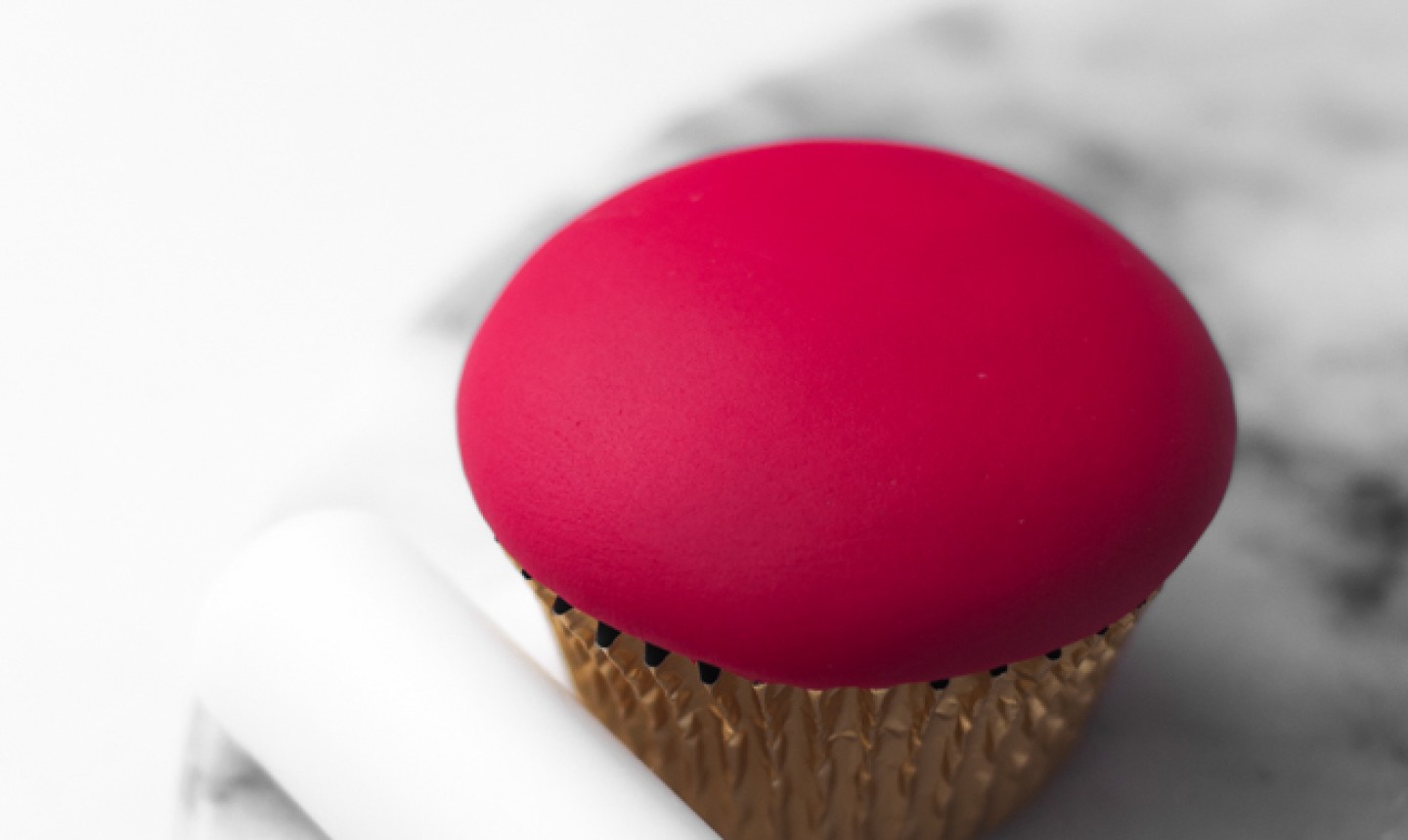 cupcake with red fondant top