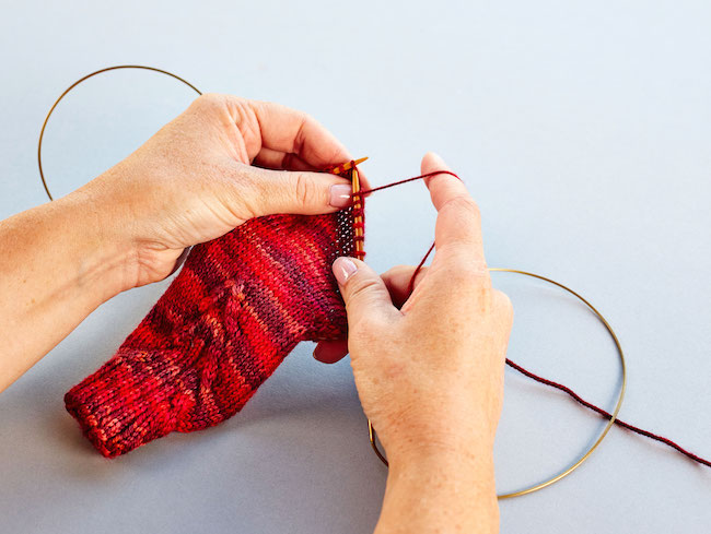 Knitting a sock leg on two circular needles 