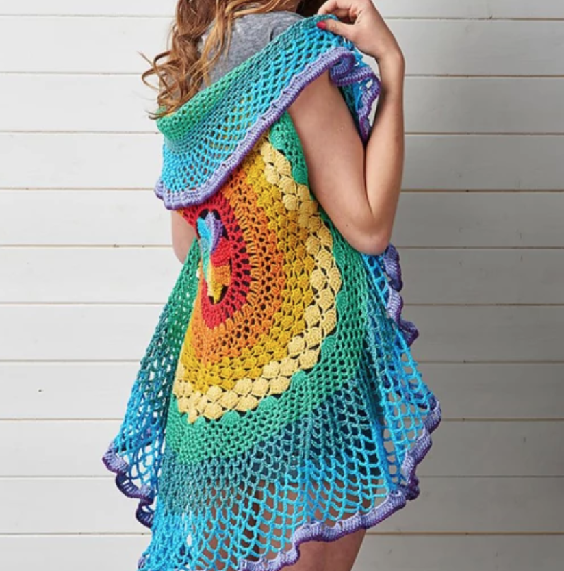 woman wearing rainbow circle crochet vest