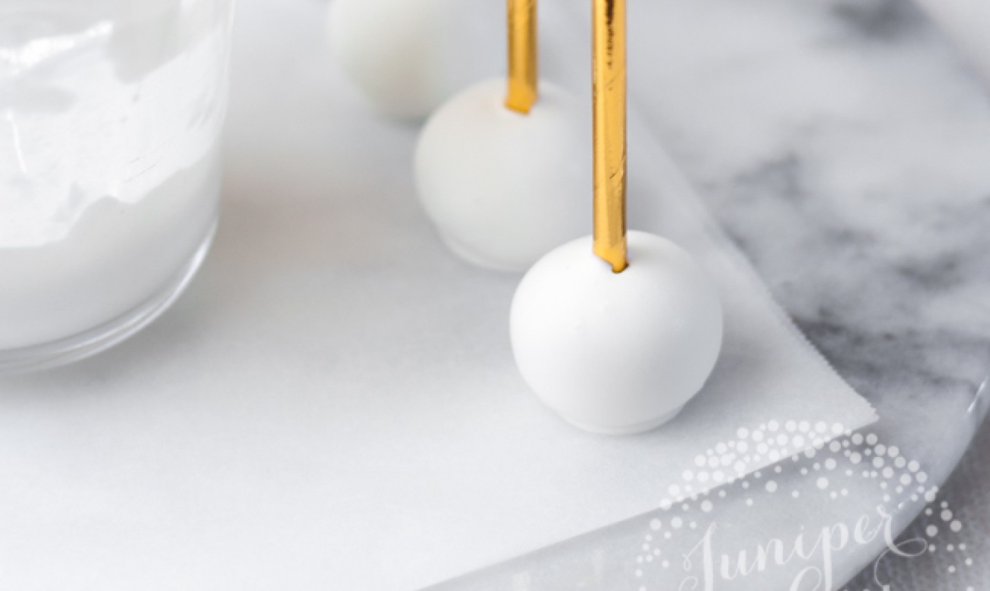 cake pops dipped in white candy coating