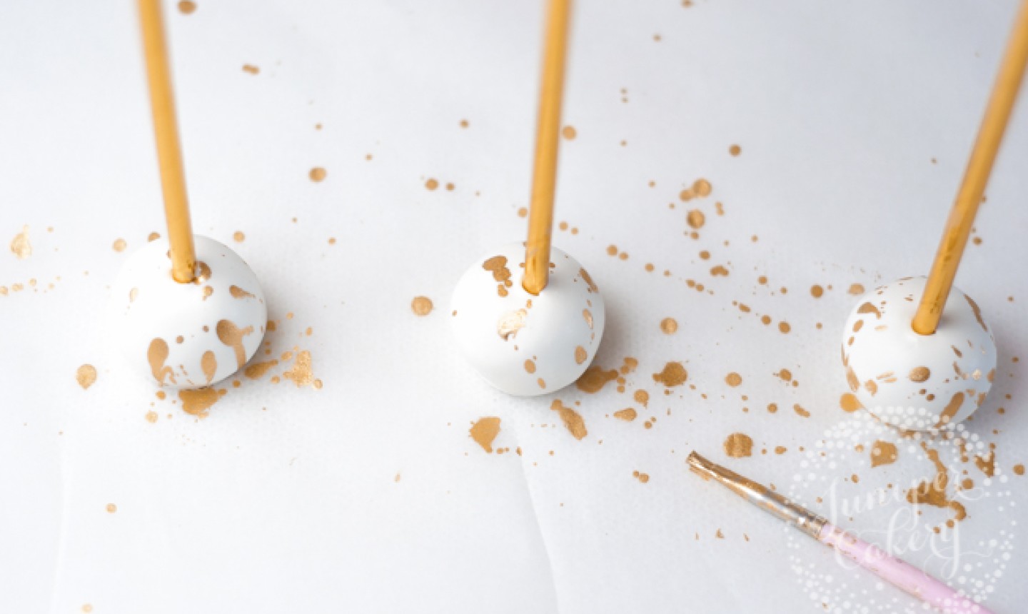 painting cake pops with gold edible paint