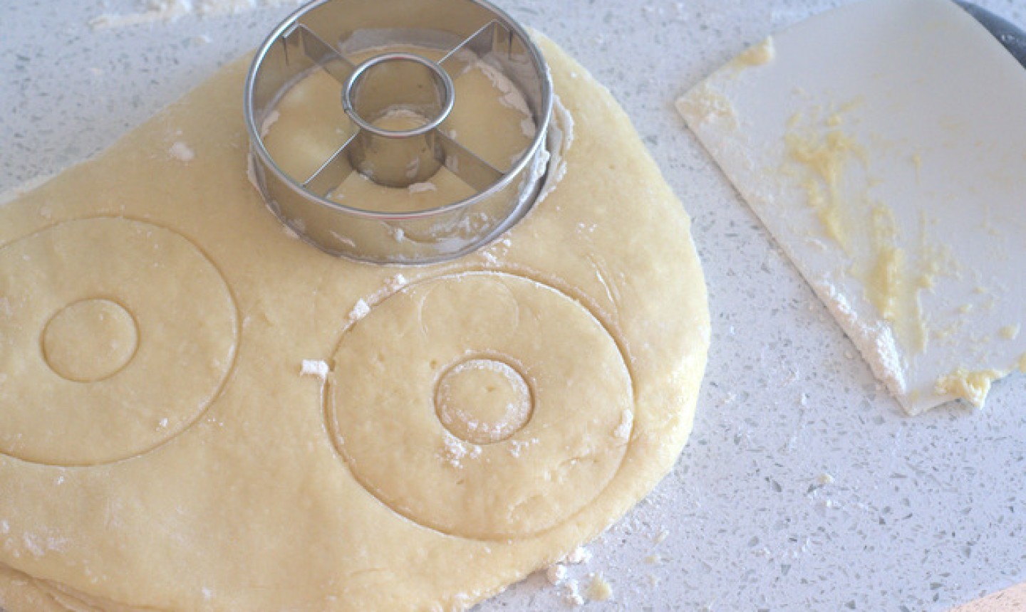 cutting donut dough