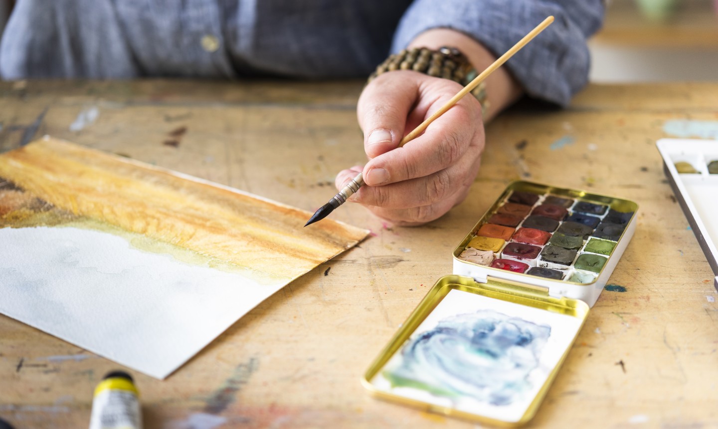 kateri holding watercolor brush