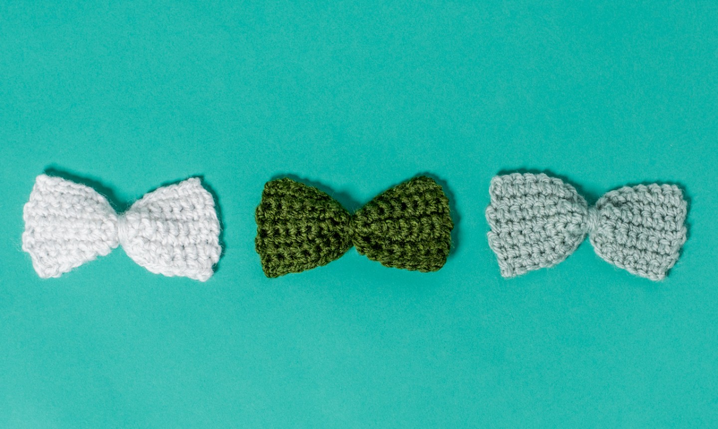 crochet bows on teal background